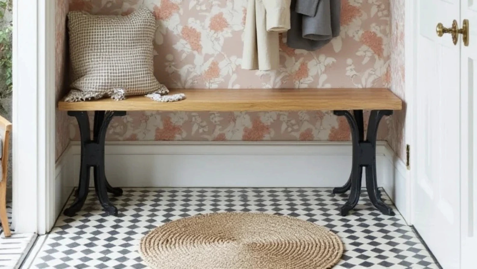 Black and White Checkerboard Limestone Mosaic Tiles featuring on an entryway.