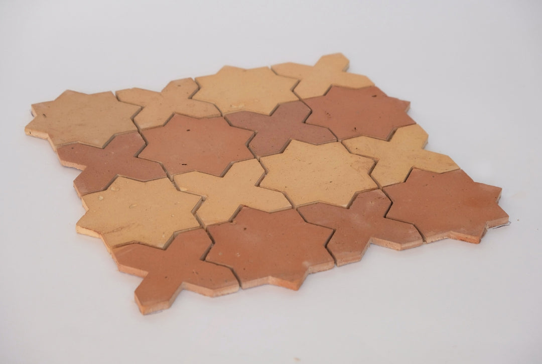 Dark and light terracotta star and crossed mosaic tile with striped pattern 