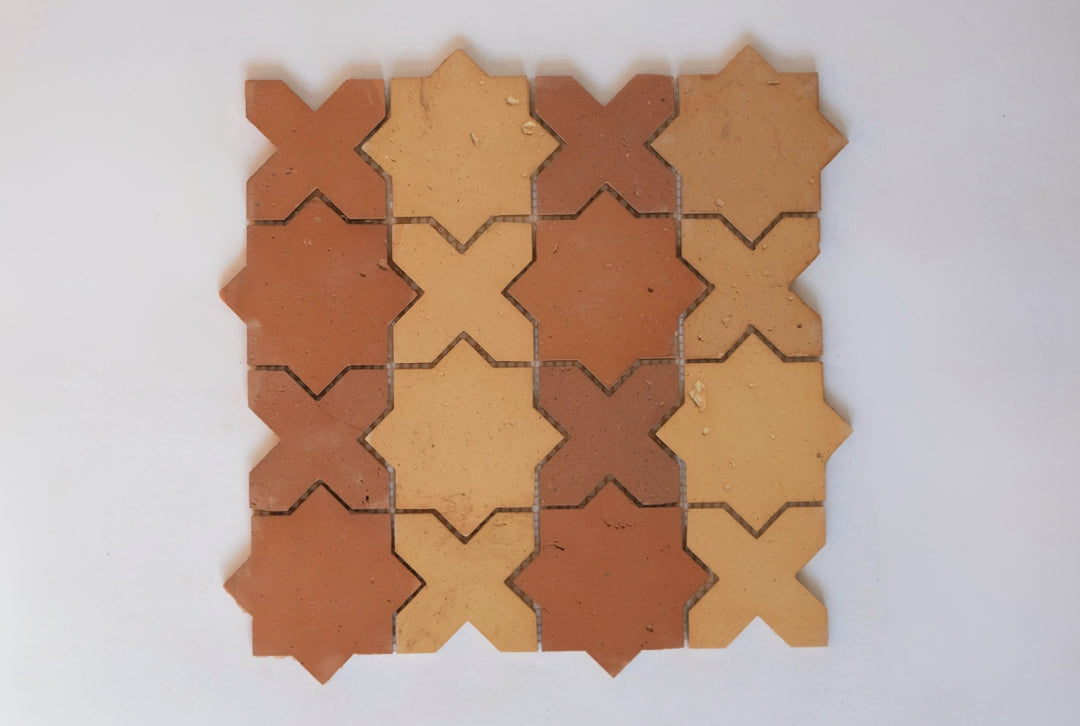 Dark and light terracotta star and crossed mosaic tile with striped pattern
