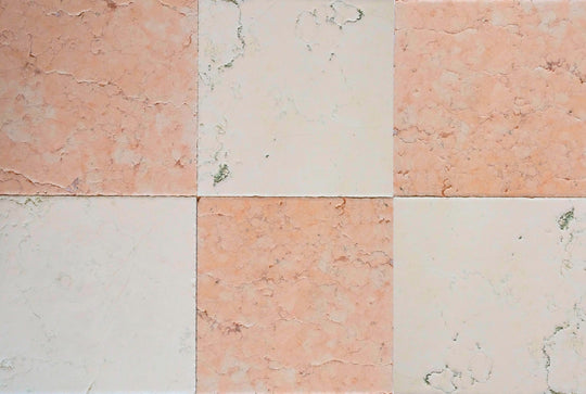 Checkered patterned tiles in shades of pink and beige.