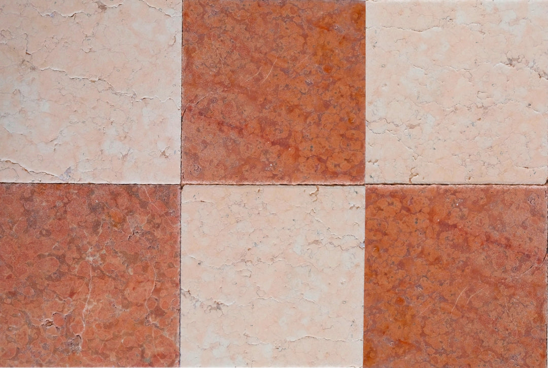 Checkered pattern of red and pink tiles