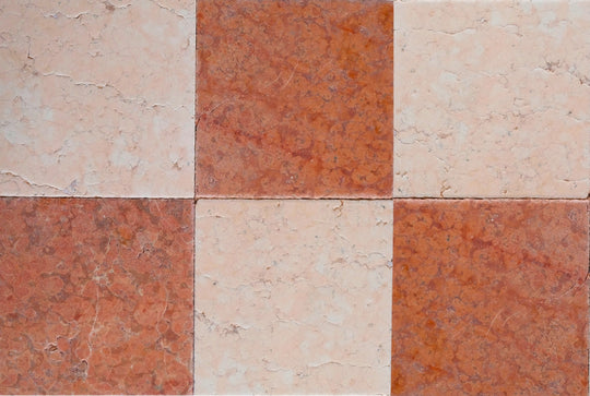 Checkered pattern of red and pink tiles