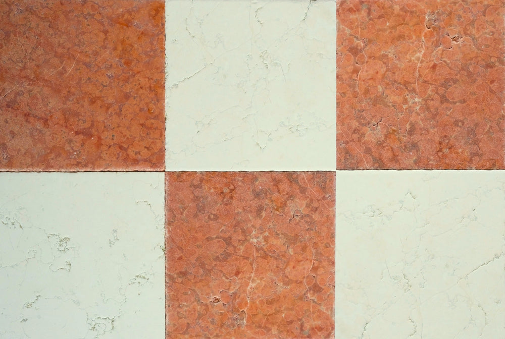 Checkered pattern of red and beige tiles