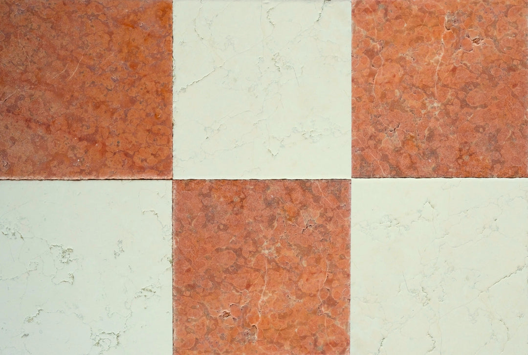 Checkered pattern of red and beige tiles