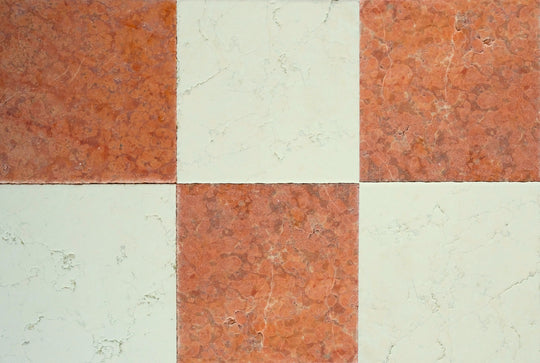 Checkered pattern of red and beige tiles
