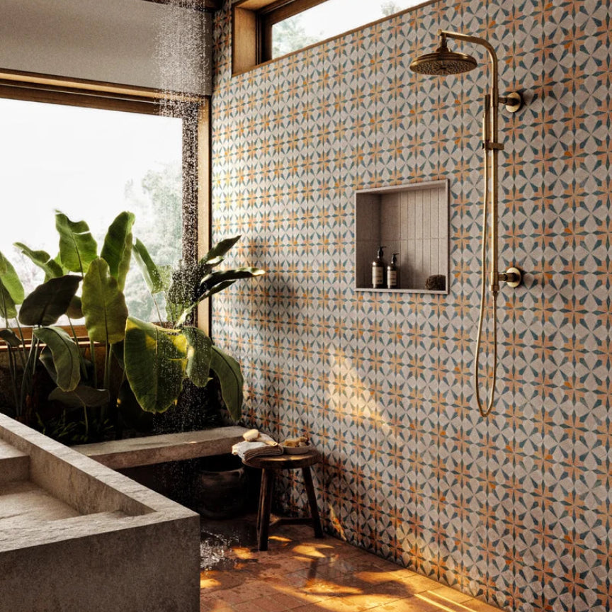 Modern bathroom with patterned tiles and plants.